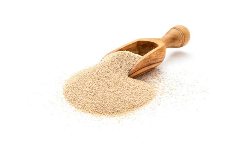 Wooden spoonful of dry yeast
